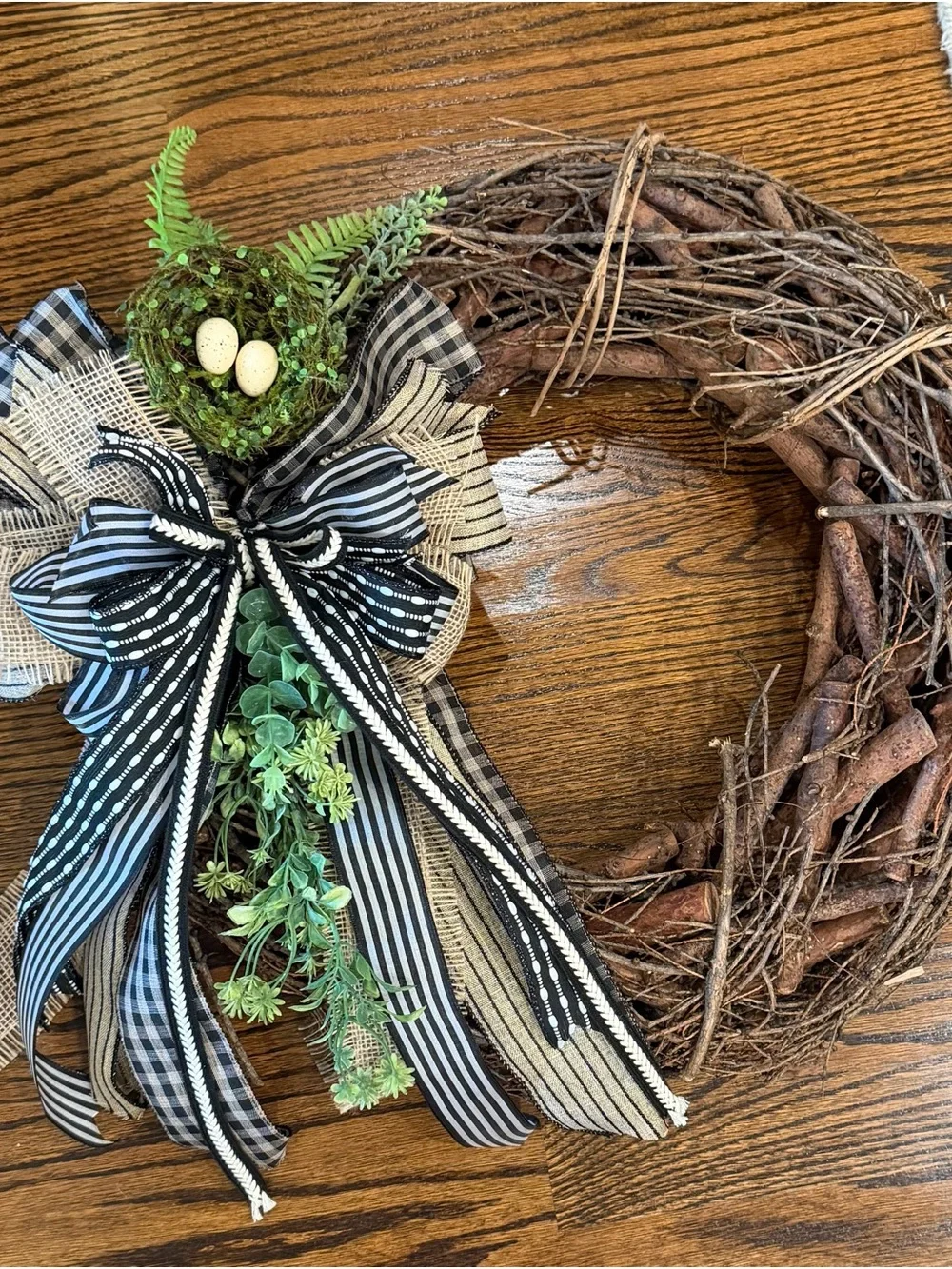 Handcrafted Black & White Ribbon Grapevine Wreath with Green Nest Accent
